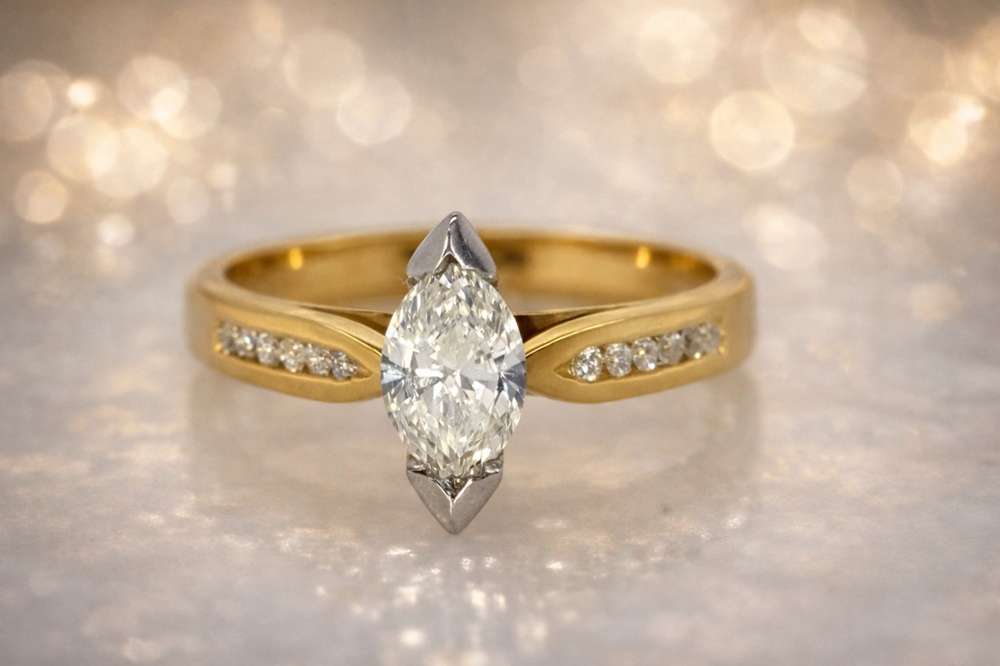 18CT TWO TONE DIAMOND MARQUISE RING.
