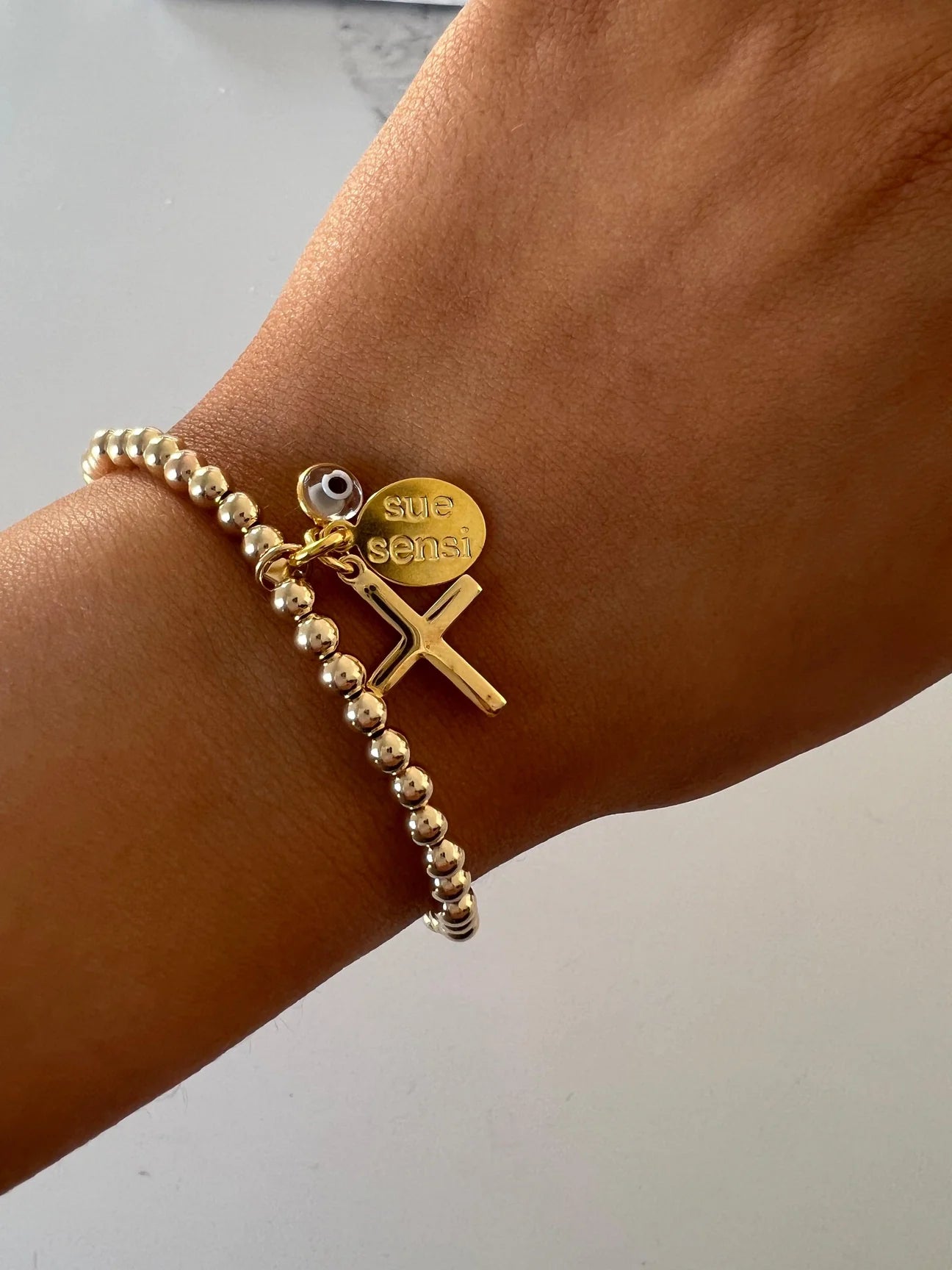 SUE SENSI FAITH AND MORE  4MM BRACELET WITH CROSS AND EVIL EYE