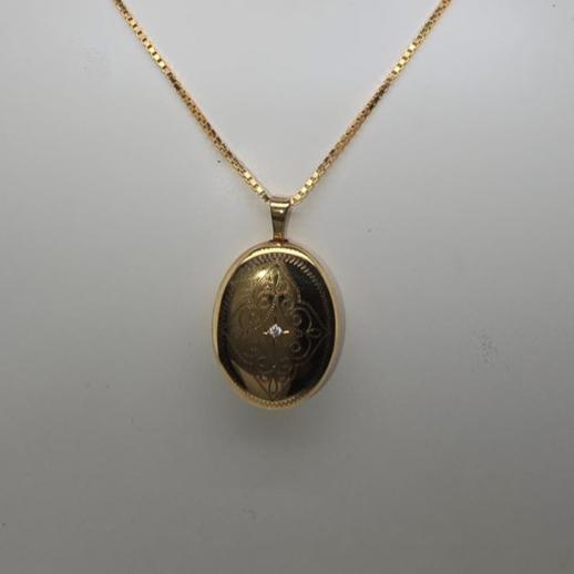 9CT YELLOW GOLD DIAMOND SET PATTERN OVAL LOCKET