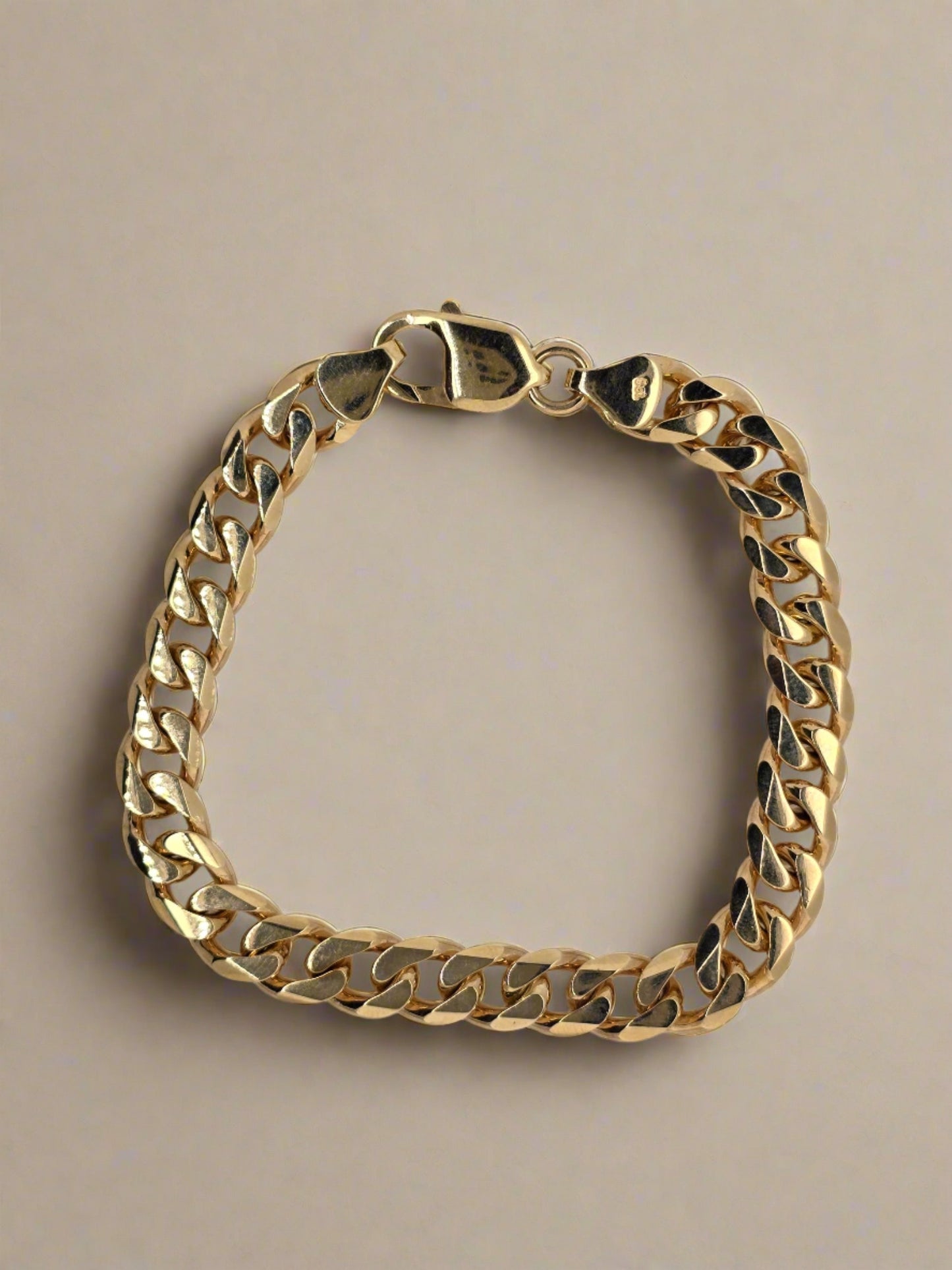 9CT YELLOW GOLD SOLID 33.2GRAMS 21CM HAND MADE SOLID CURB BRACELET.