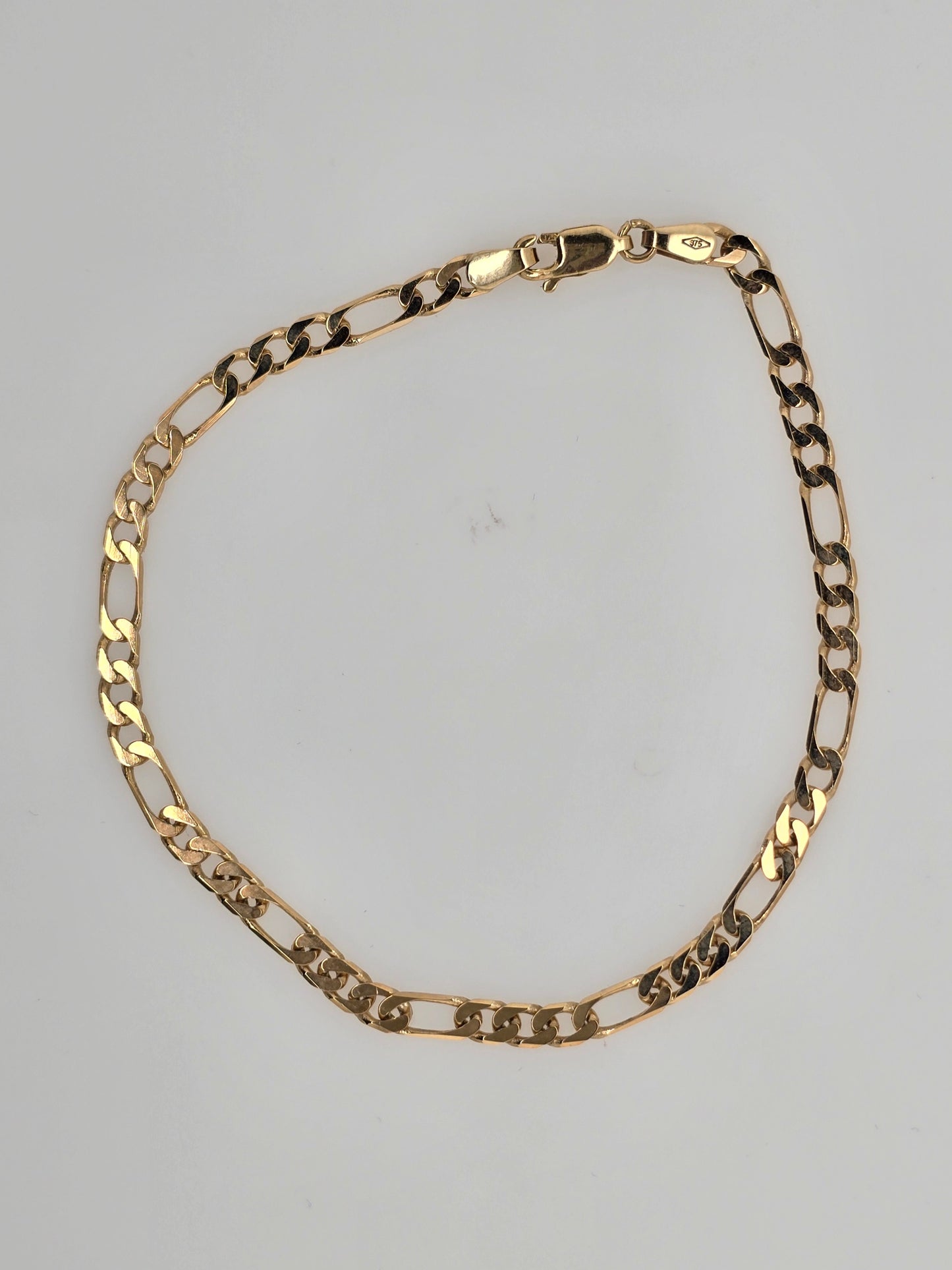 9CT YELLOW GOLD SOLID 3 X 1 FIGARO 21CM DIAMOND CUT BRACELET 4GRAMS.