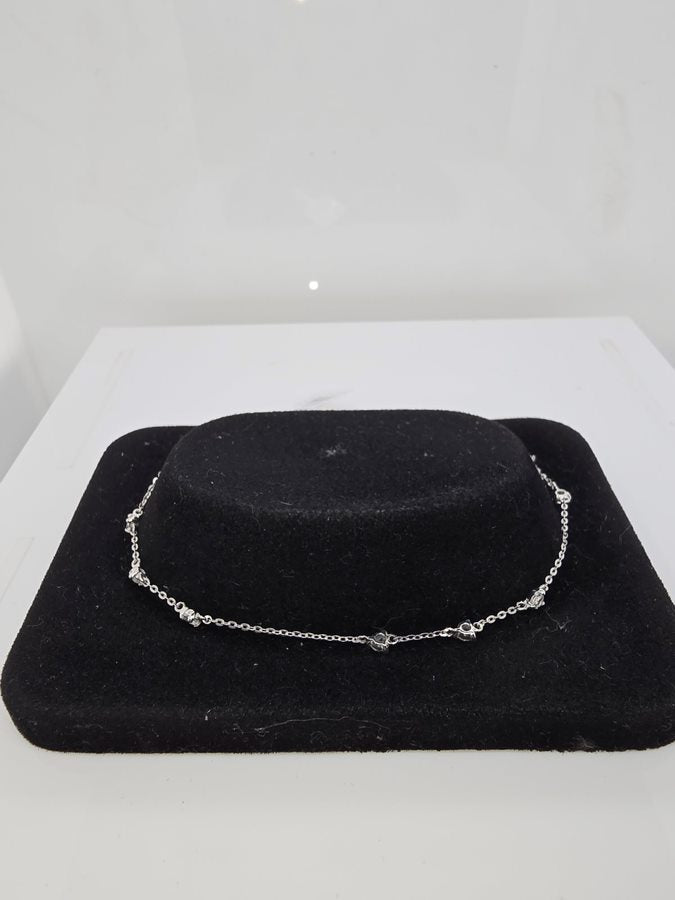 9CT WHITE GOLD 9 X CUBIC ZIRCONIA 19CM BRACELET