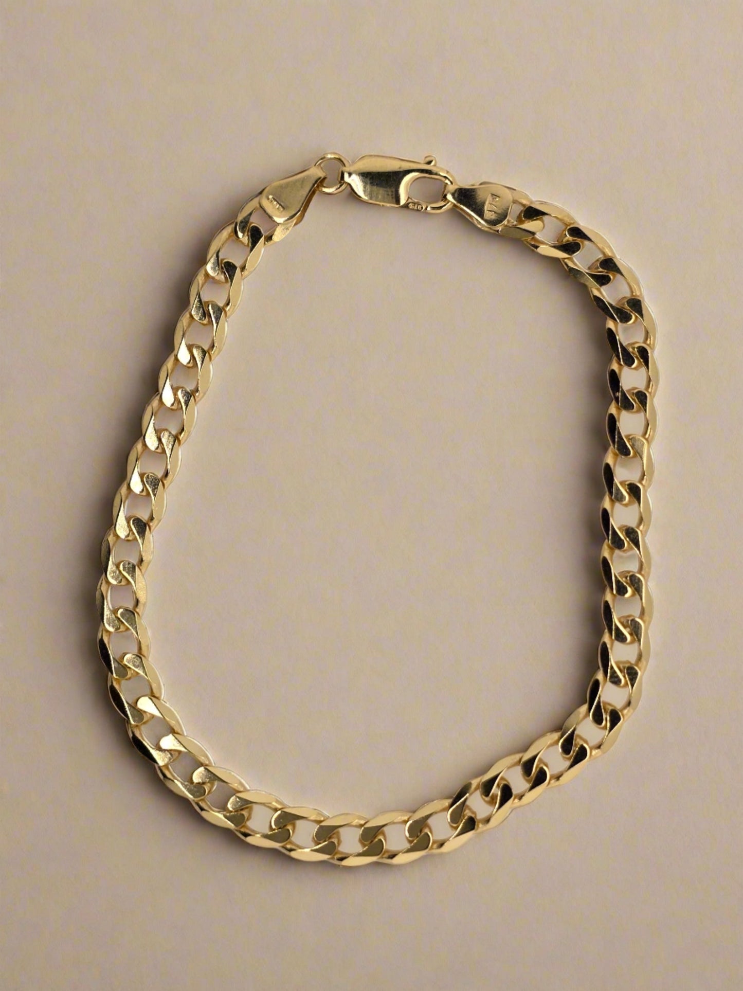 9CT YELLOW GOLD ITALIAN DIAMOND CUT 21CM SOLID CURB BRACELET 9.76GRAMS.