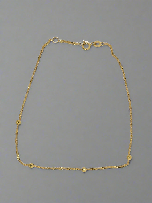 9CT YELLOW GOLD 24CM TWIST AND BALL ANKLET.