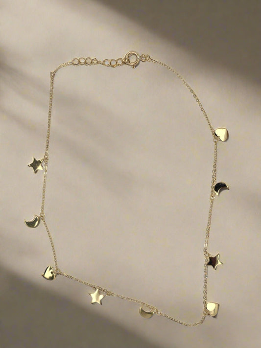 9CT YELLOW GOLD IMPORTED STAR, MOON AND HEART CHARM ANKLET 23-25CM.