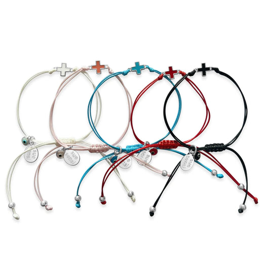 SUE SENSI IN A DREAM PINK CORD WITH CROSS BRACELET.