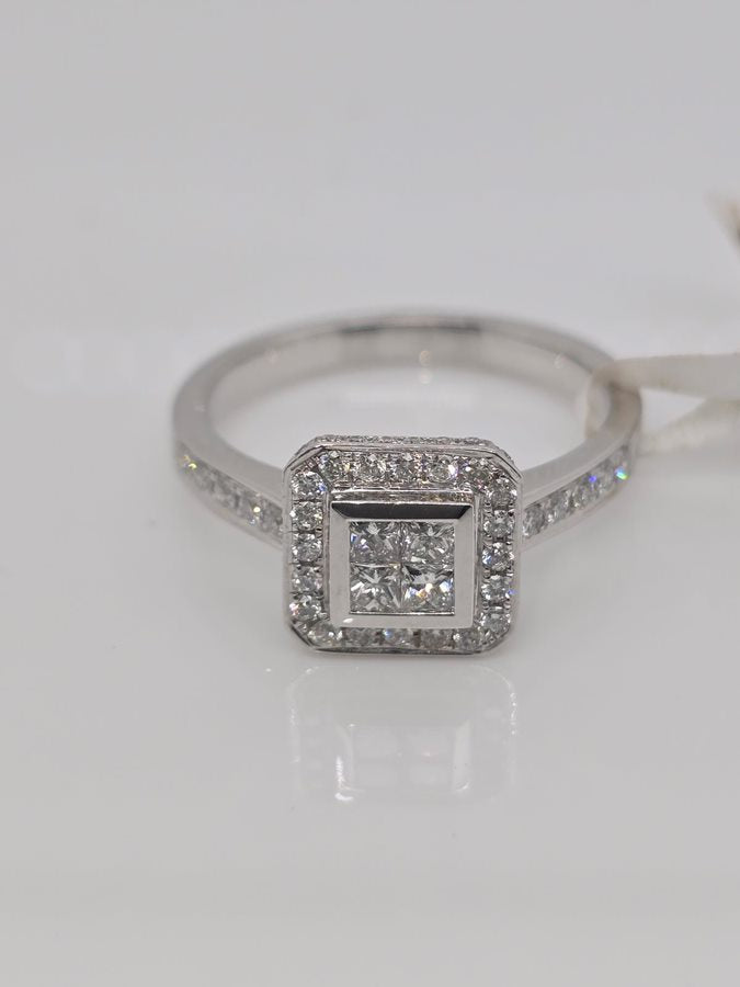 18CT WHITE GOLD INVISIBLE AND GRAIN SET DIAMOND RING.